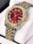 Gold and red watch